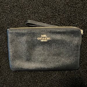 Black and gold coach wristlet